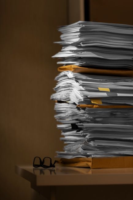 pile of documents on a desk
